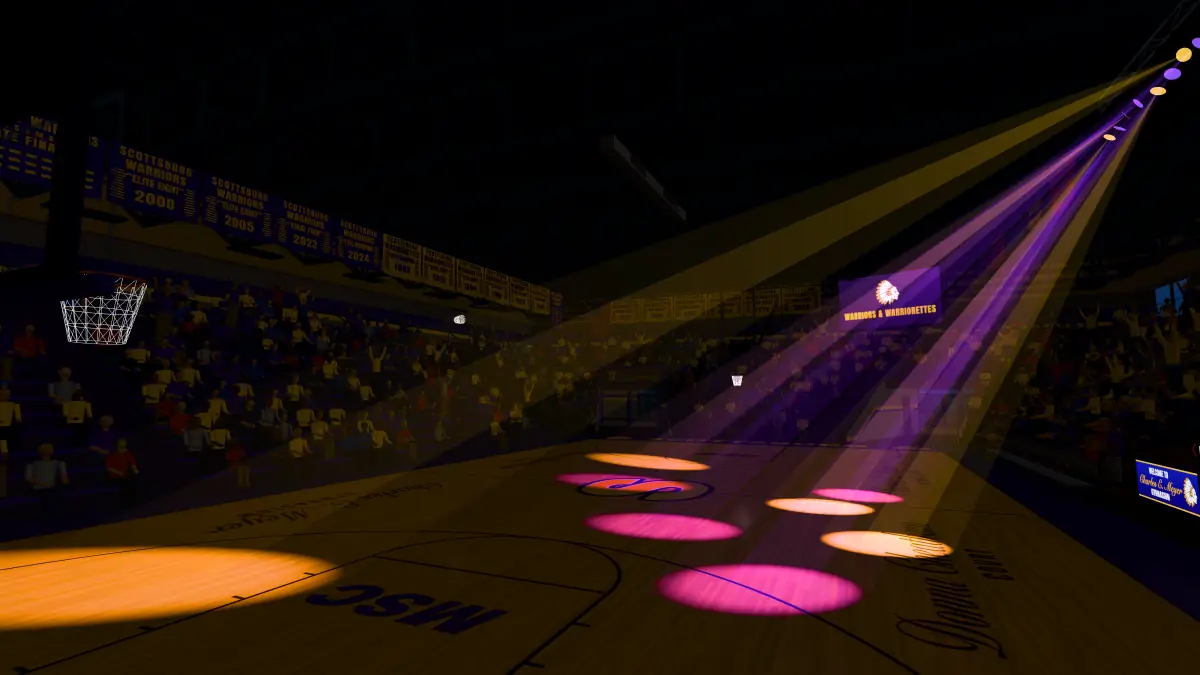 The gym in the dark, purple and gold spotlights sweeping the court